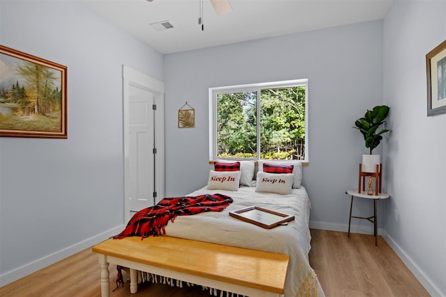 bedroom featuring ceiling fan and light hardwood / wood-style flooring