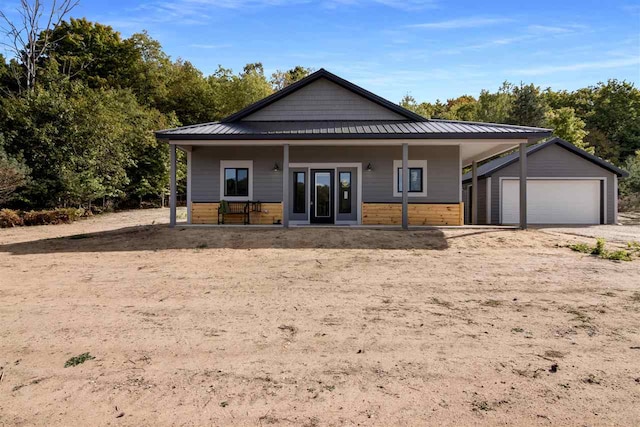 view of front of home with a garage and covered porch