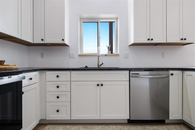 kitchen with dishwasher, sink, and white cabinets