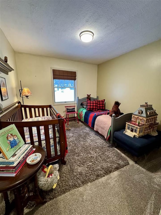 bedroom with carpet flooring and a textured ceiling