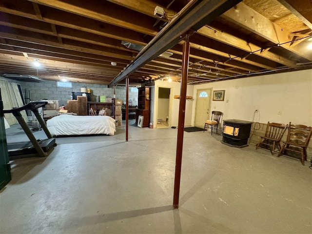 basement featuring a wood stove