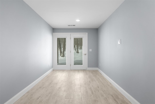 doorway with light hardwood / wood-style floors