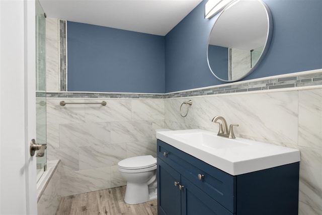 bathroom with vanity, wood-type flooring, and toilet