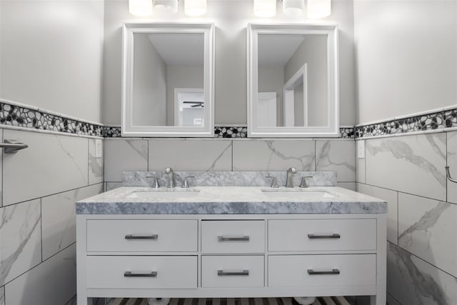 bathroom featuring tile walls and vanity