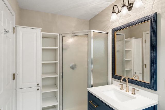 bathroom featuring vanity and an enclosed shower