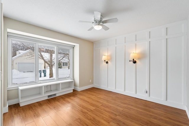 spare room featuring ceiling fan and light wood-type flooring