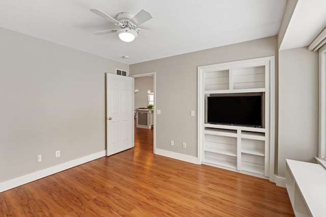 unfurnished living room with ceiling fan and light hardwood / wood-style floors