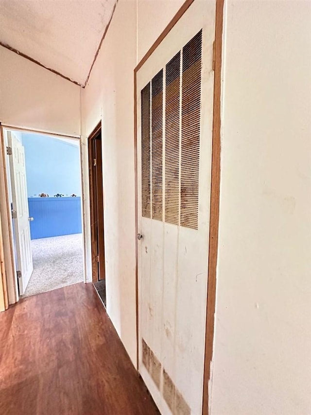 hallway featuring hardwood / wood-style floors and a water view