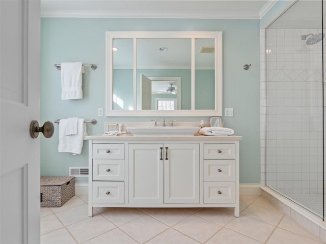 bathroom with crown molding, vanity, an enclosed shower, and tile patterned flooring