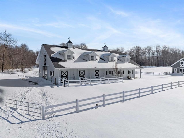 view of snow covered house