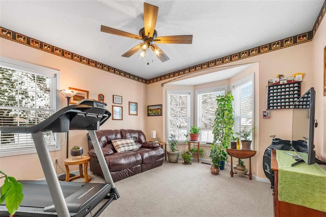 workout room featuring carpet floors and ceiling fan