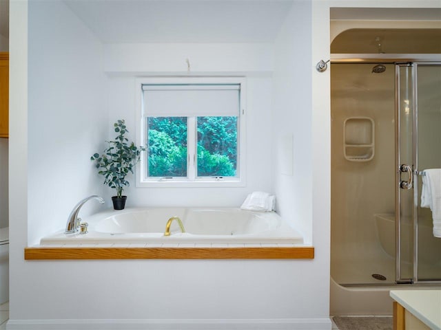 bathroom with shower with separate bathtub