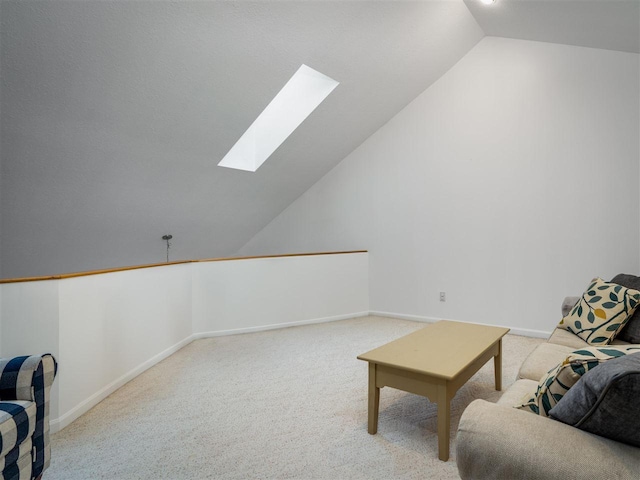 living area with lofted ceiling with skylight and light carpet