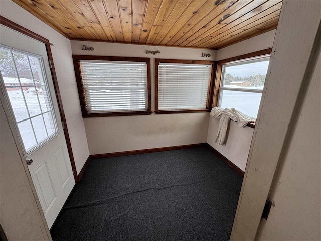 unfurnished sunroom featuring wooden ceiling