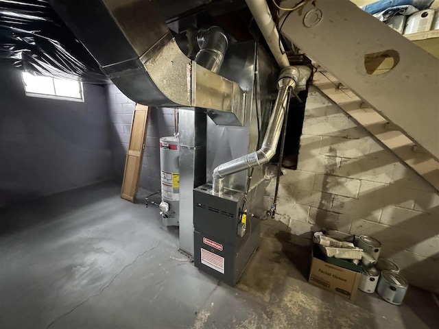 utility room featuring water heater