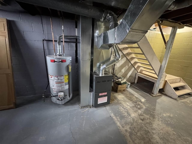 utility room featuring water heater