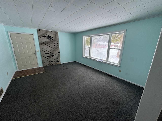 carpeted empty room with ornamental molding