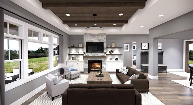 living room featuring hardwood / wood-style flooring, a stone fireplace, wood ceiling, and a tray ceiling