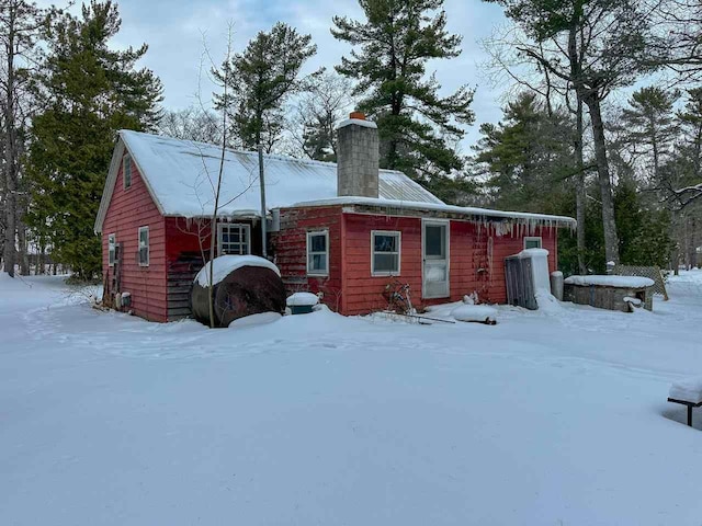 view of snow covered house