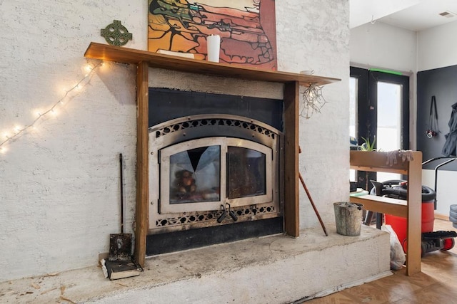 interior details featuring parquet flooring