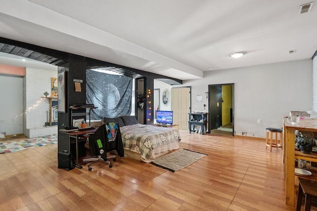 bedroom with hardwood / wood-style flooring