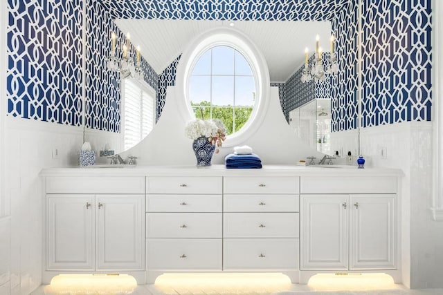 bathroom featuring lofted ceiling and vanity