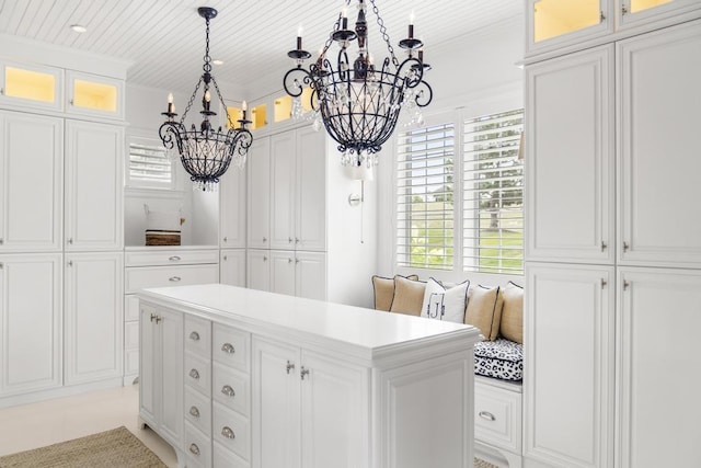 spacious closet featuring a notable chandelier