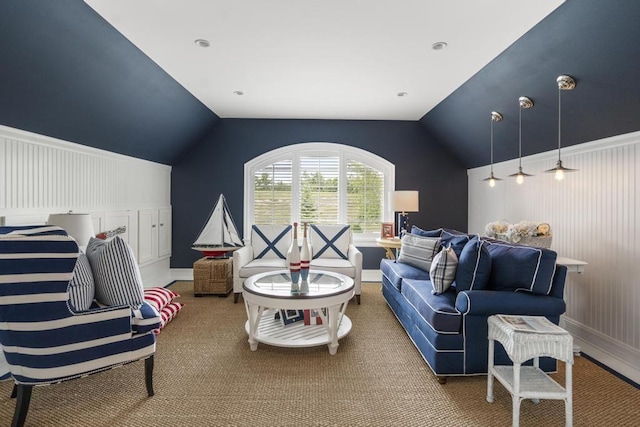 carpeted living room with vaulted ceiling