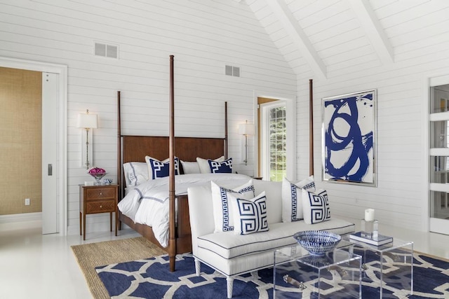 bedroom with high vaulted ceiling, beamed ceiling, and wood walls