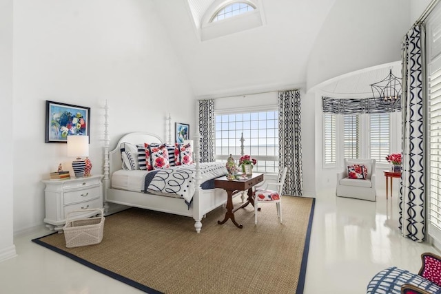 bedroom featuring high vaulted ceiling