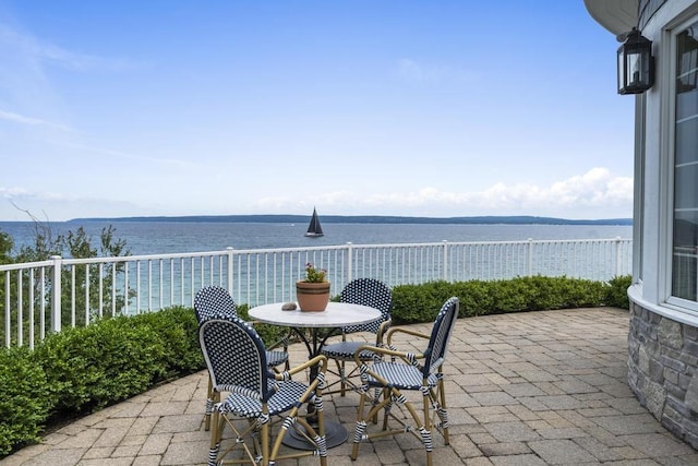 view of patio / terrace featuring a water view