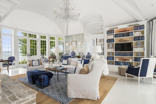 living room featuring beamed ceiling, a notable chandelier, high vaulted ceiling, and french doors