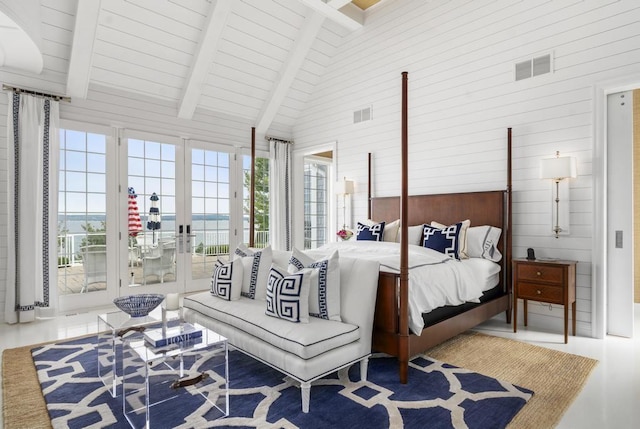 bedroom featuring high vaulted ceiling, wooden walls, access to exterior, and beam ceiling