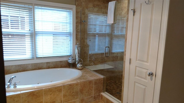 bathroom with separate shower and tub