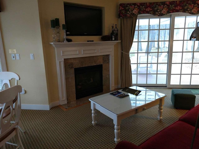 living room featuring a premium fireplace