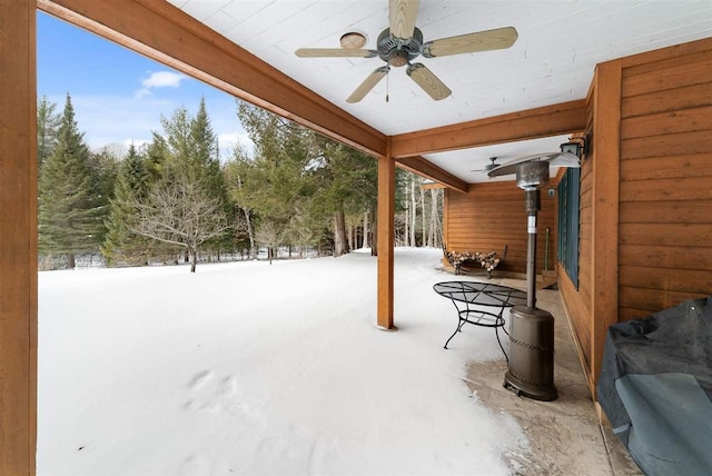 snow covered patio with ceiling fan