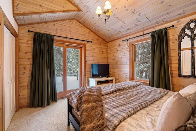 bedroom with vaulted ceiling, light carpet, multiple windows, and wood walls