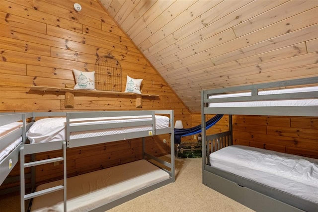 unfurnished bedroom featuring vaulted ceiling, carpet flooring, wooden ceiling, and wood walls