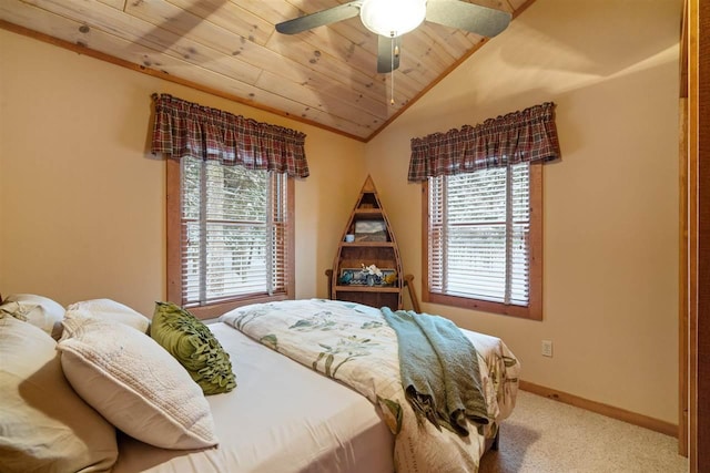 bedroom with wood ceiling, ceiling fan, vaulted ceiling, and light carpet