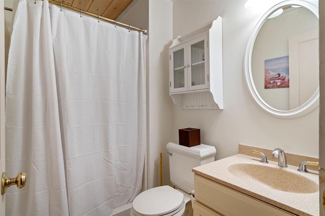 bathroom with walk in shower, vanity, and toilet