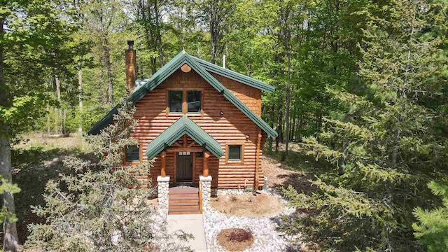 view of log cabin