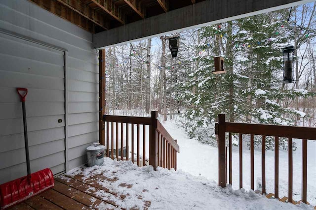 view of snow covered deck