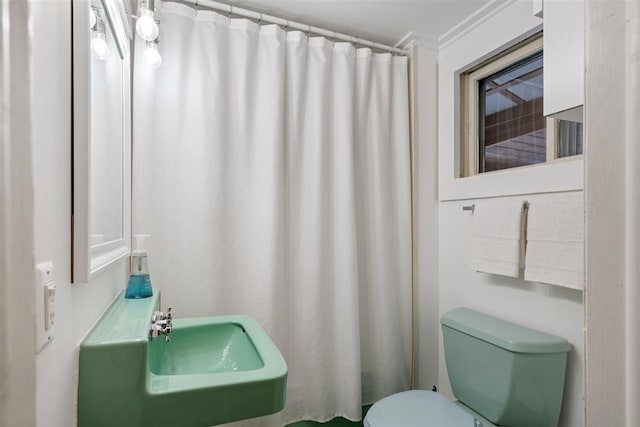 bathroom with sink and toilet