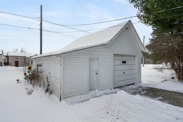 view of snow covered garage