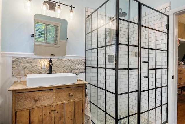 bathroom with vanity and tiled shower