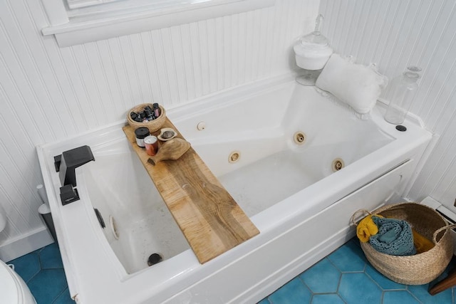 bathroom featuring a tub to relax in and tile patterned floors