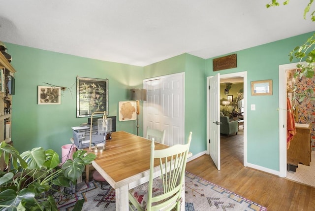 dining space featuring hardwood / wood-style floors