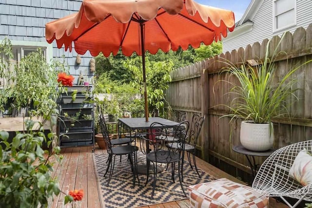 wooden balcony featuring a deck