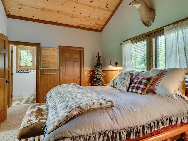 carpeted bedroom with wood ceiling, vaulted ceiling, and multiple windows