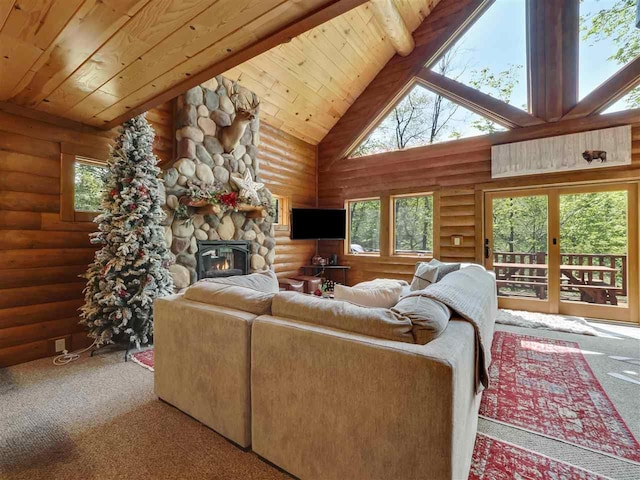 carpeted living room featuring wood ceiling, a fireplace, rustic walls, and a healthy amount of sunlight